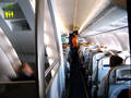 Looking forward at the first section of economy class and stair entrance to washroom