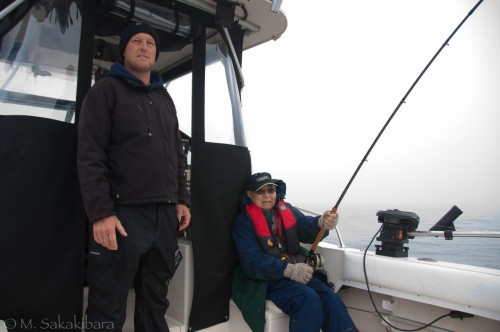 Dad fights a chinook salmon